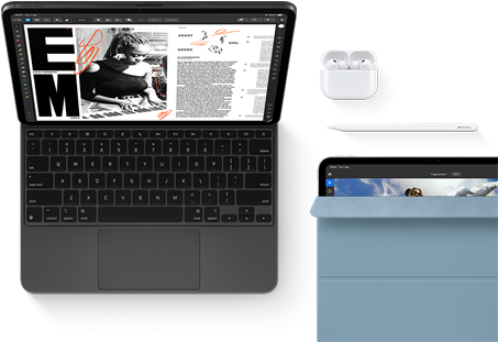 iPad Pro attached to Magic Keyboard, front exterior, space black colour, rounded corners, black display bezel, open, display showing article editing app with text and photograph of a woman playing music, Airpods 4 in open case, blue Smart Folio cover on iPad Pro with Apple Pencil Pro resting atop device, cover slightly open revealing display